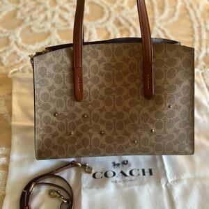 Coach Charlie Carryall bag in Signature Canvas customised with Coach riverts.